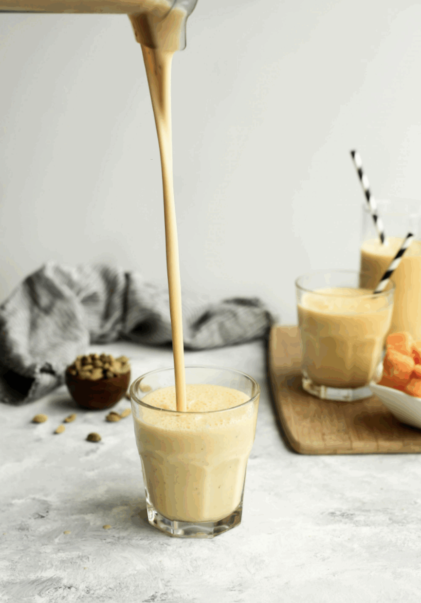 pouring sweet and salty mango lassi drink