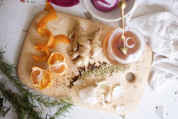 cutting board with tea, ginger, herbs, and citrus_birth control and vitamin deficiency