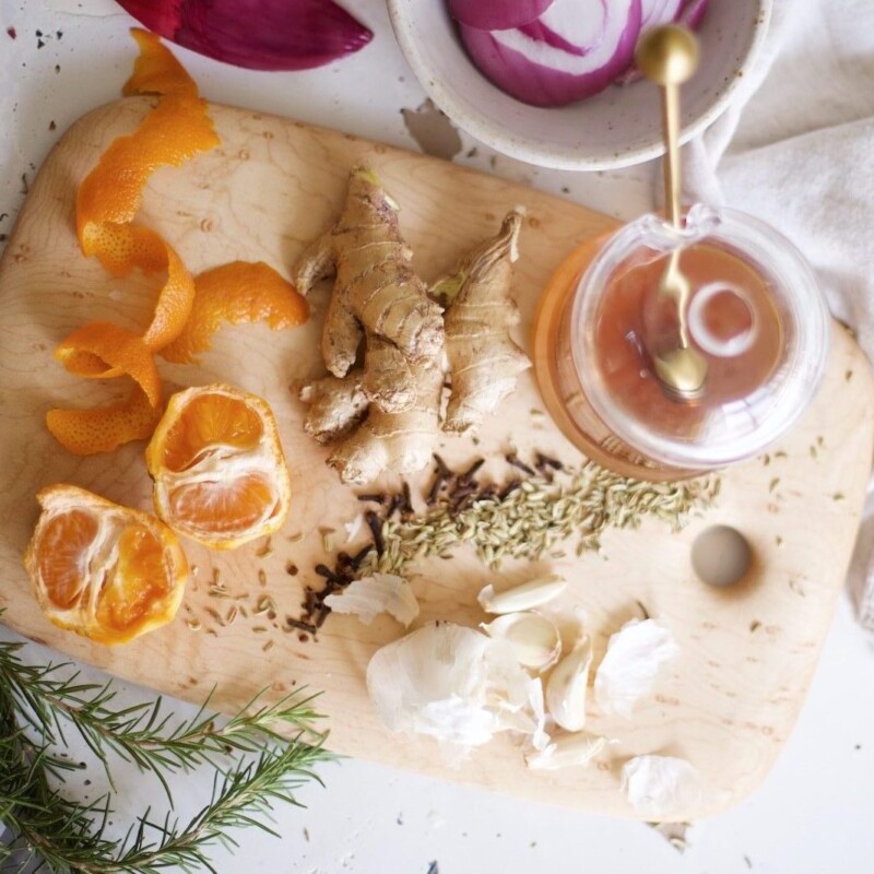 cutting board with tea, ginger, herbs, and citrus_birth control and vitamin deficiency
