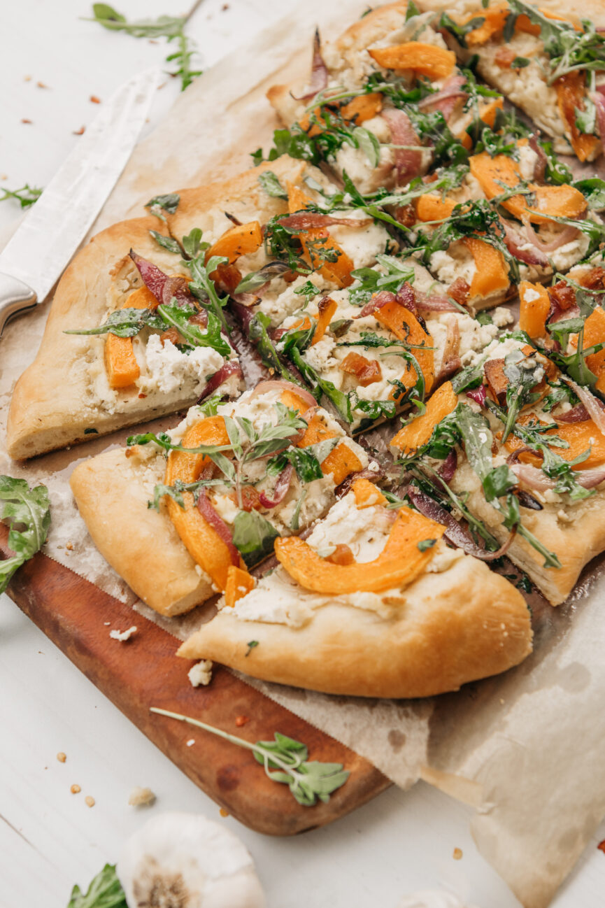 butternut squash flatbread with arugula and almond ricotta sliced