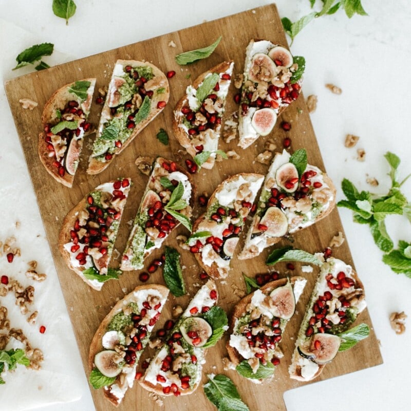 burrata toasts on serving tray