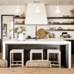 neutral white kitchen with plaster hood