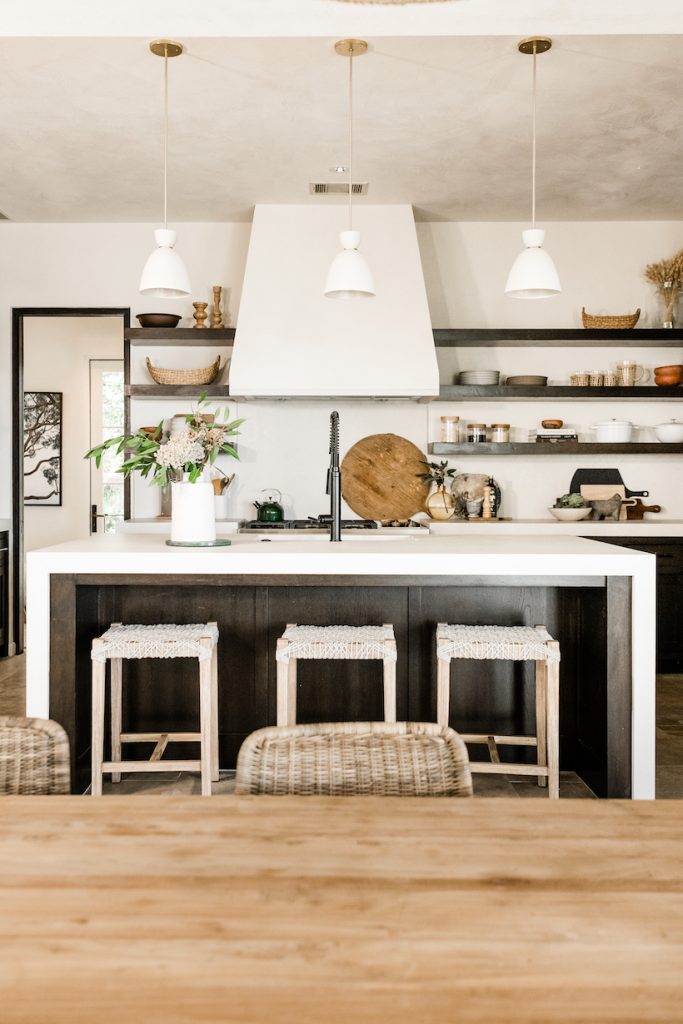 neutral white kitchen with plaster hood