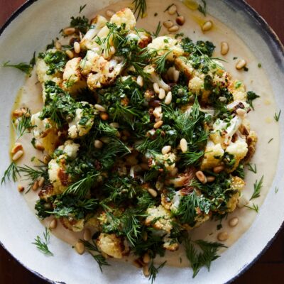 roasted cauliflower with garlic tahini, chimichurri, and dill
