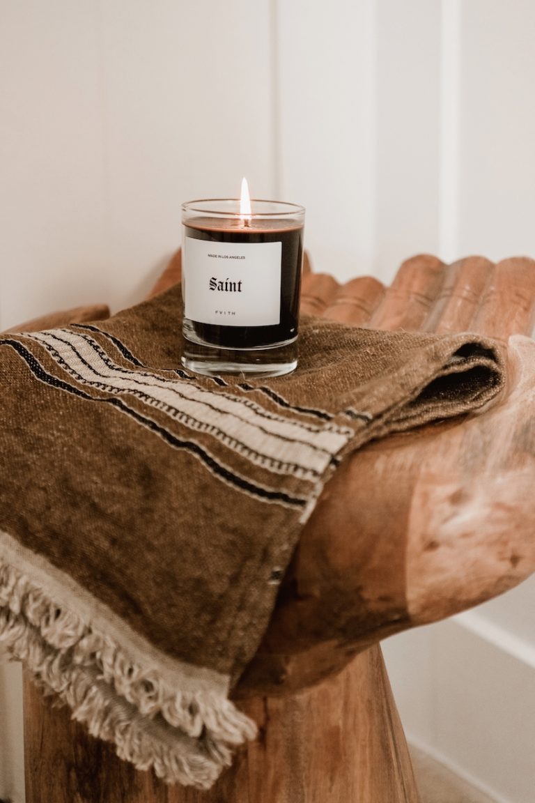 candles and towels on hand table