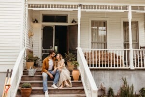 Couple smiling on front porch