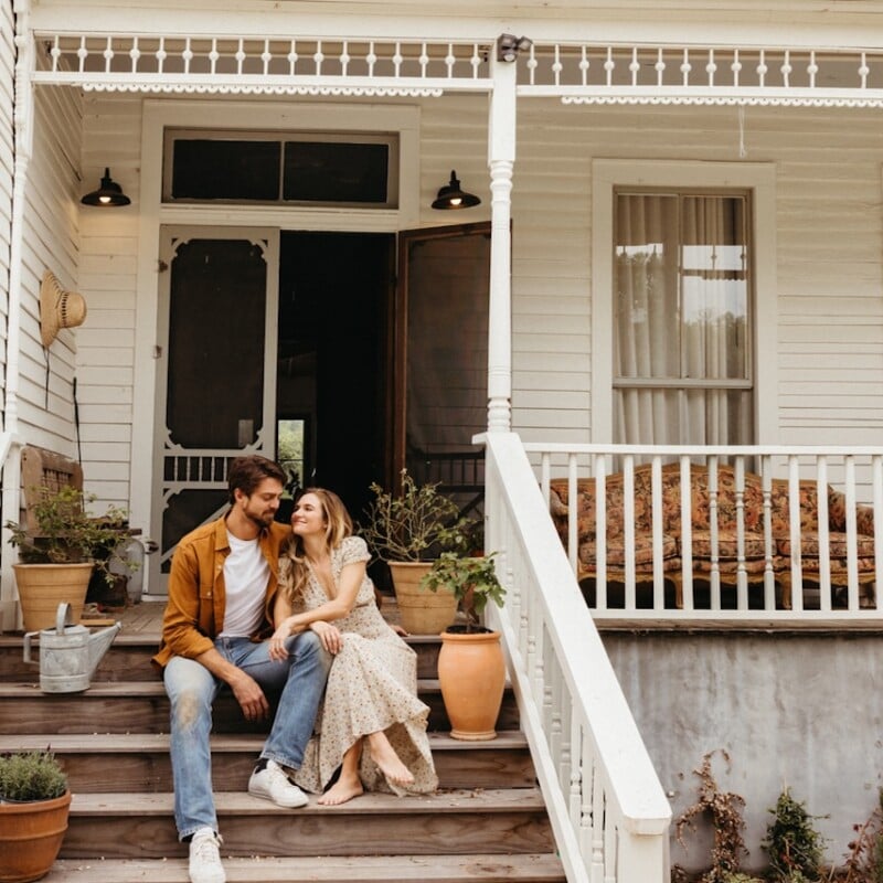 Couple smiling on front porch