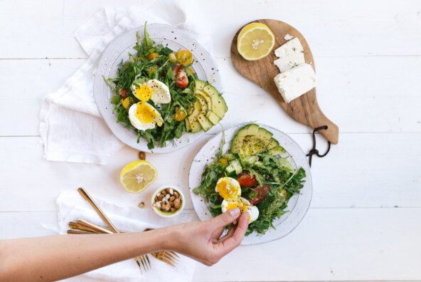 salads topped with soft boiled eggs