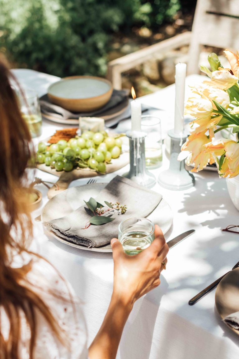 summer table setting ideas, Camille Styles summer dinner party table in backyard with trees