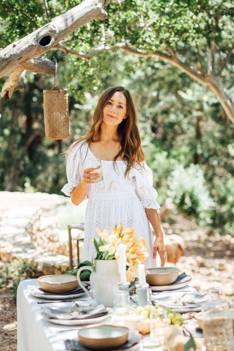 summer table setting ideas, Camille Styles summer dinner party table in backyard with trees