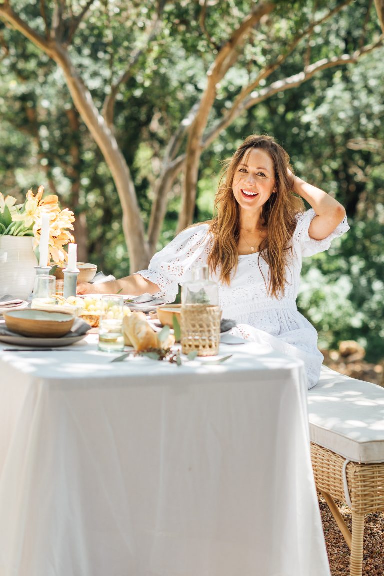 summer table setting ideas, Camille Styles summer dinner party table in backyard with trees