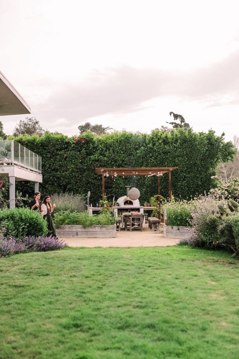 beautiful backyard with covered terrace and pizza oven - helene henderson home - malibu farm