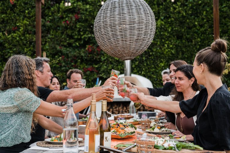 cheers - toast with wine - summer dinner party, fresh veggies, helene henderson -malibu farm