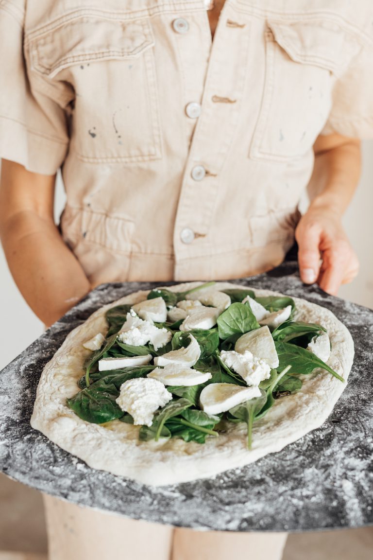 Camille Styles spinach and ricotta homemade pizza recipe baked in oven on pizza stone