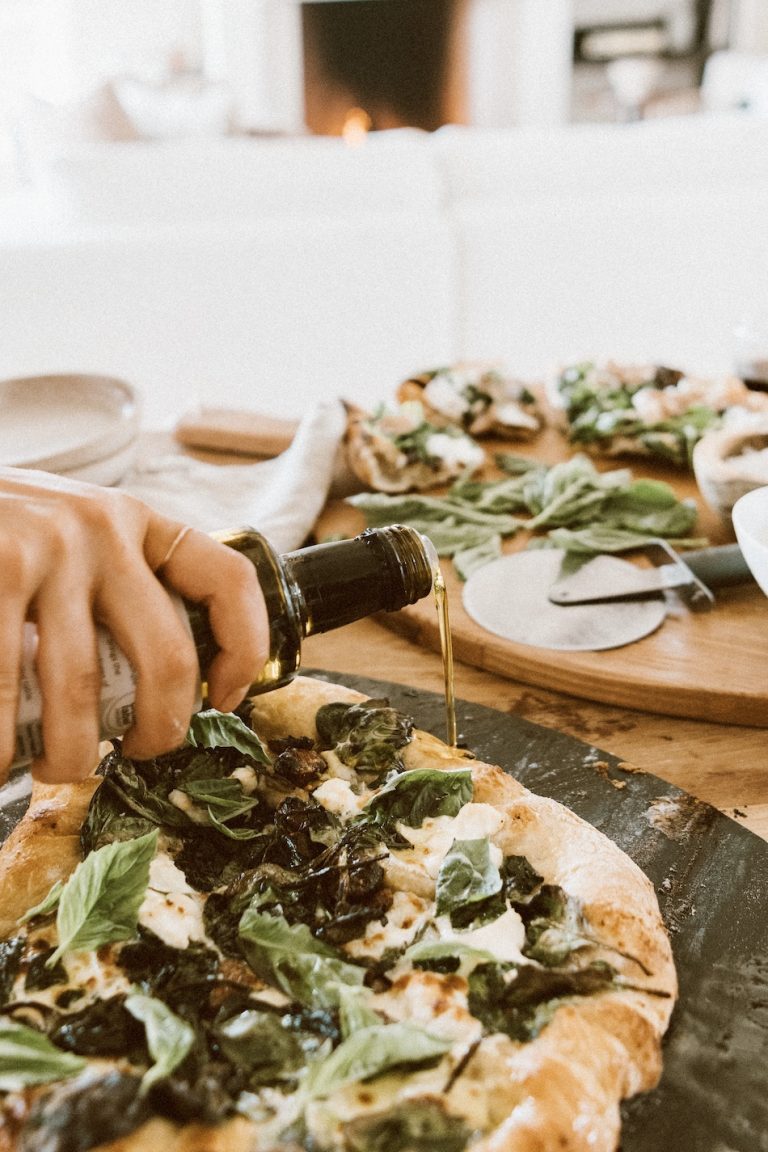 Camille Styles spinach and ricotta homemade pizza recipe baked in oven on pizza stone