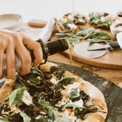 Camille Styles spinach and ricotta homemade pizza recipe baked in oven on pizza stone