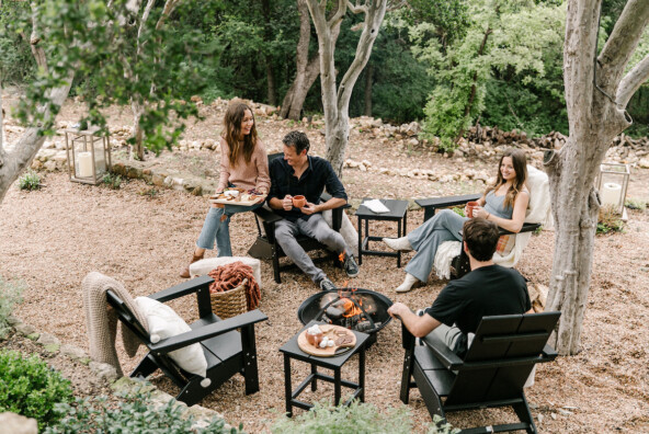 friends hanging out around fire pit with s'mores, backyard game night to celebrate fall with target, cozy, blankets and throws