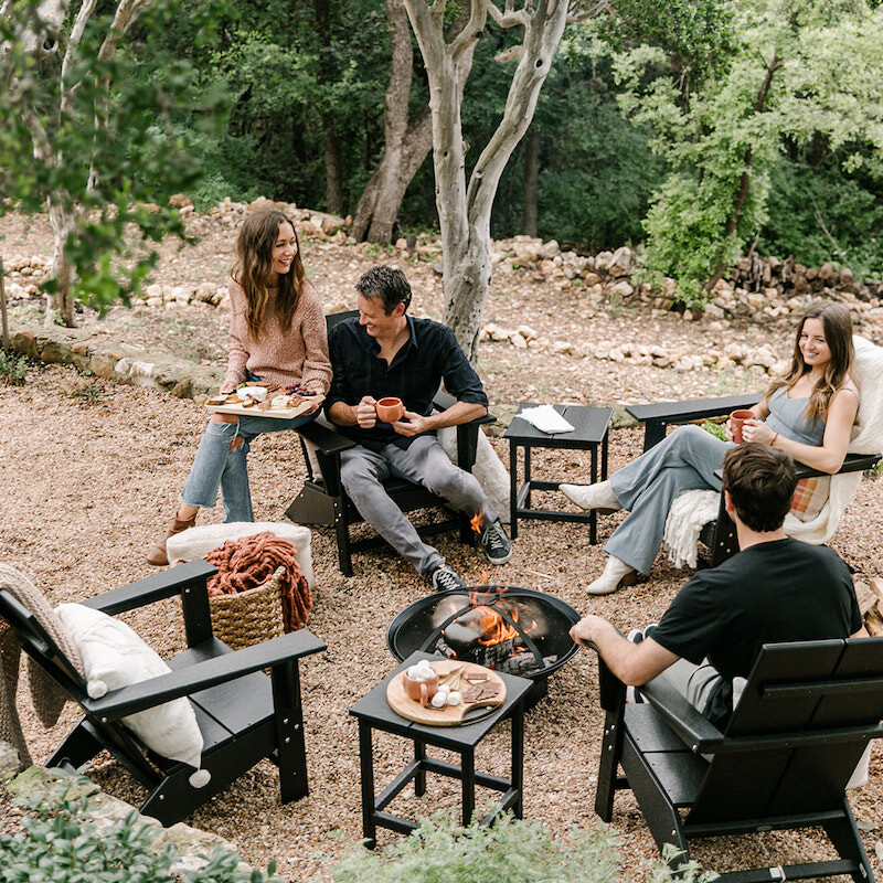 friends hanging out around fire pit with s'mores, backyard game night to celebrate fall with target, cozy, blankets and throws
