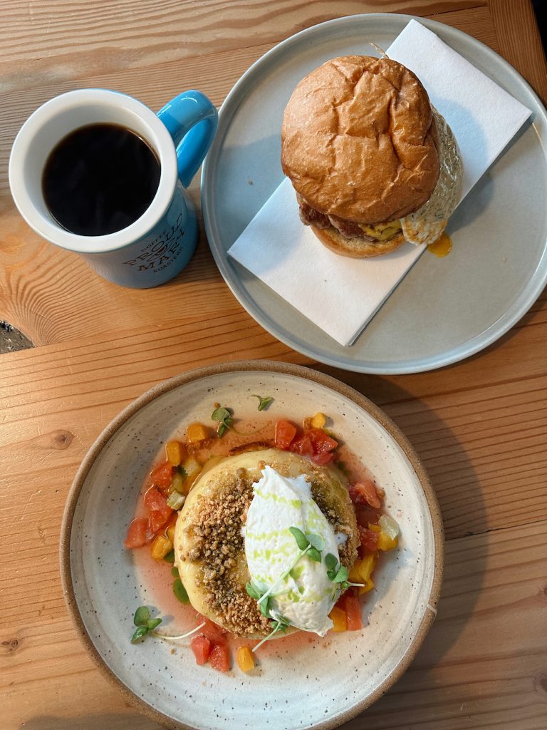 Ricotta hotcake, breakfast sandwich, and black coffee at Proud Mary in Austin.