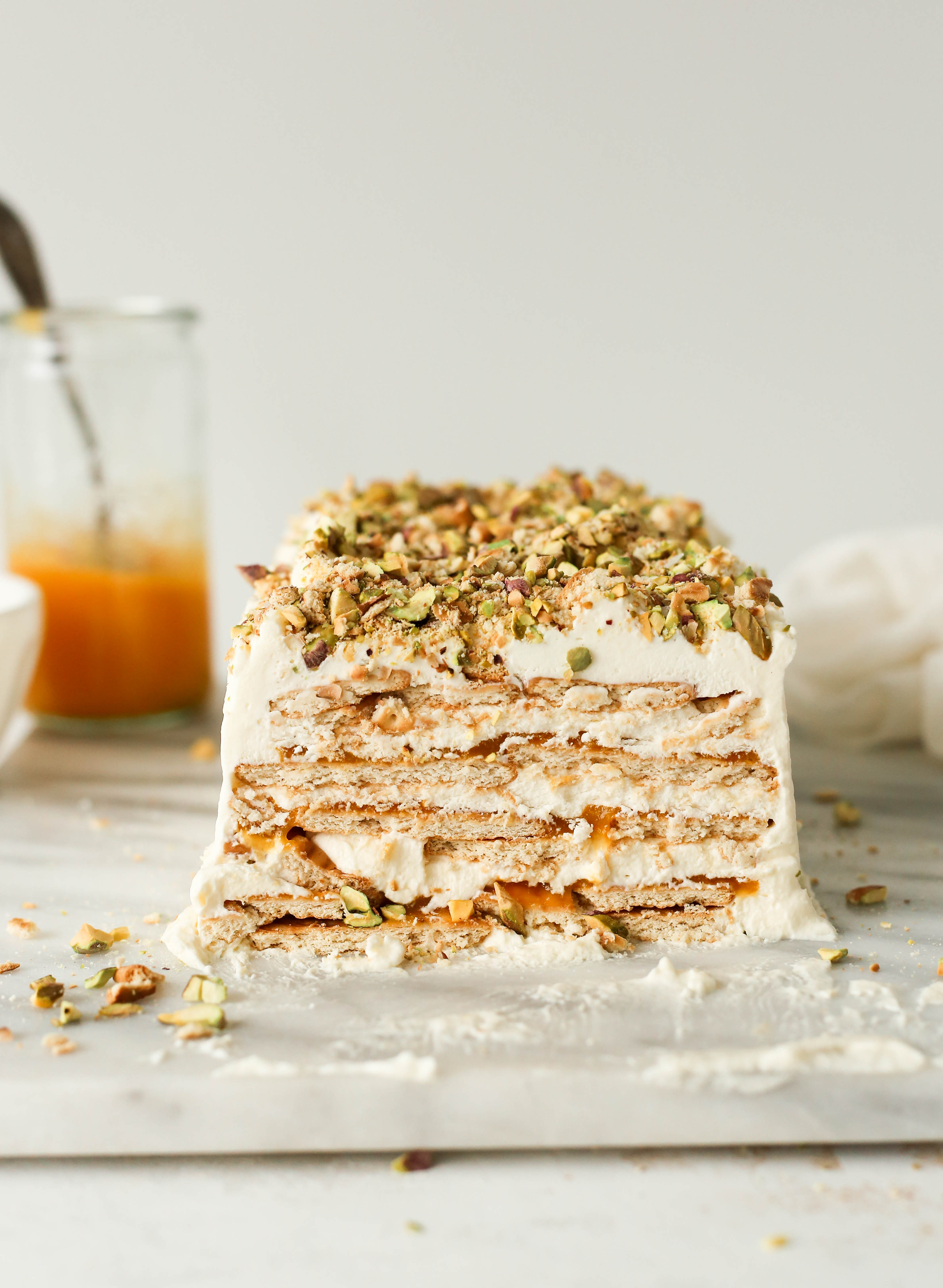 celebrate summer with this no bake mango and cardamom cream icebox cake with a salty pistachio crumble