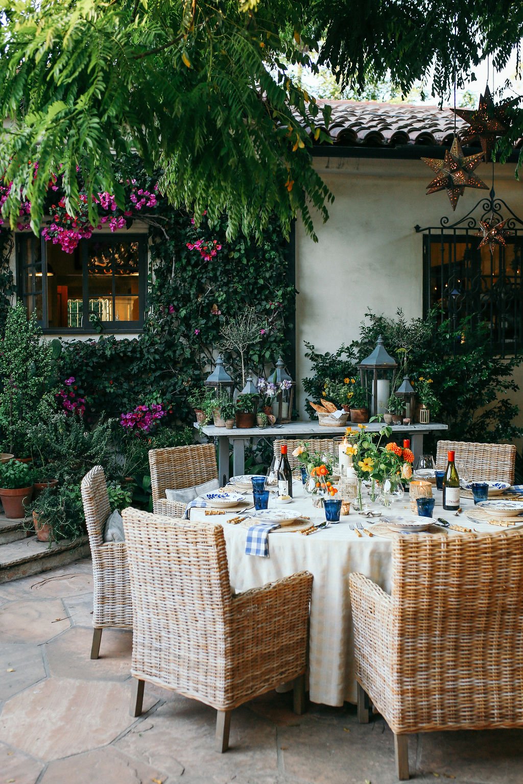 Valerie Rice dinner party in Santa Barbara, bougainvillea and mediterranean house exterior, table setting