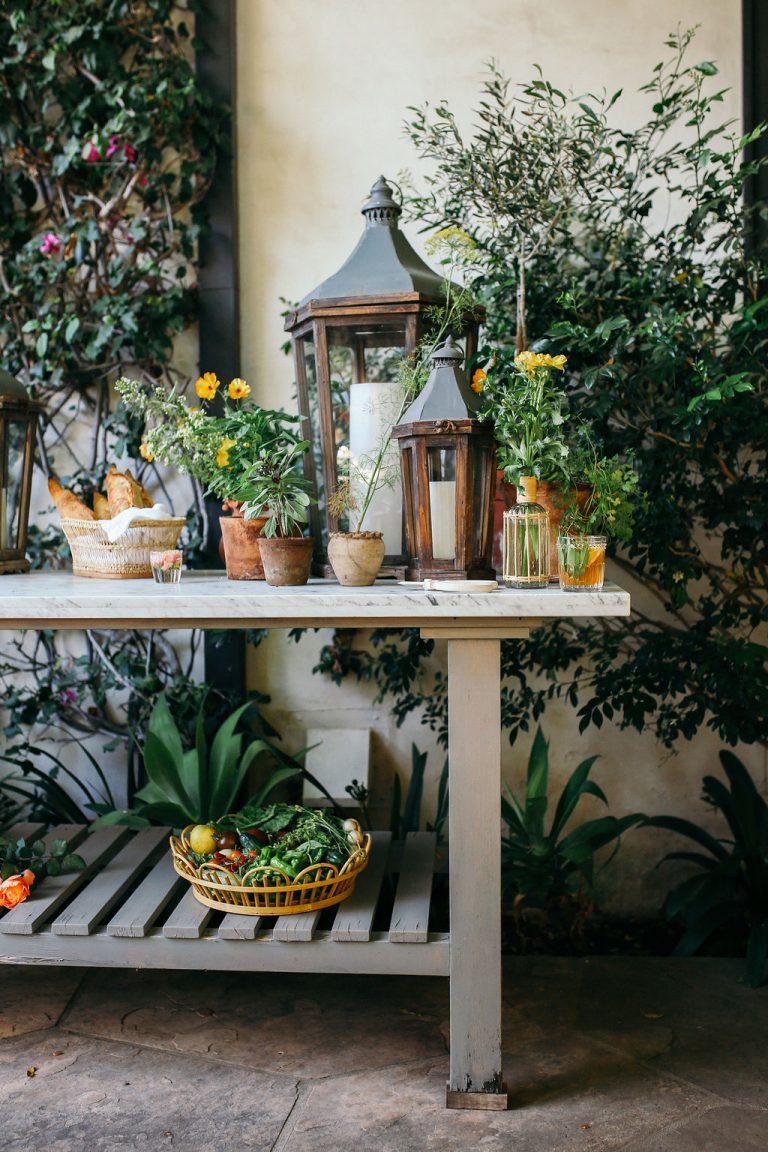 Valerie Rice dinner party in Santa Barbara, bougainvillea and mediterranean house exterior, bar on potting bench setup