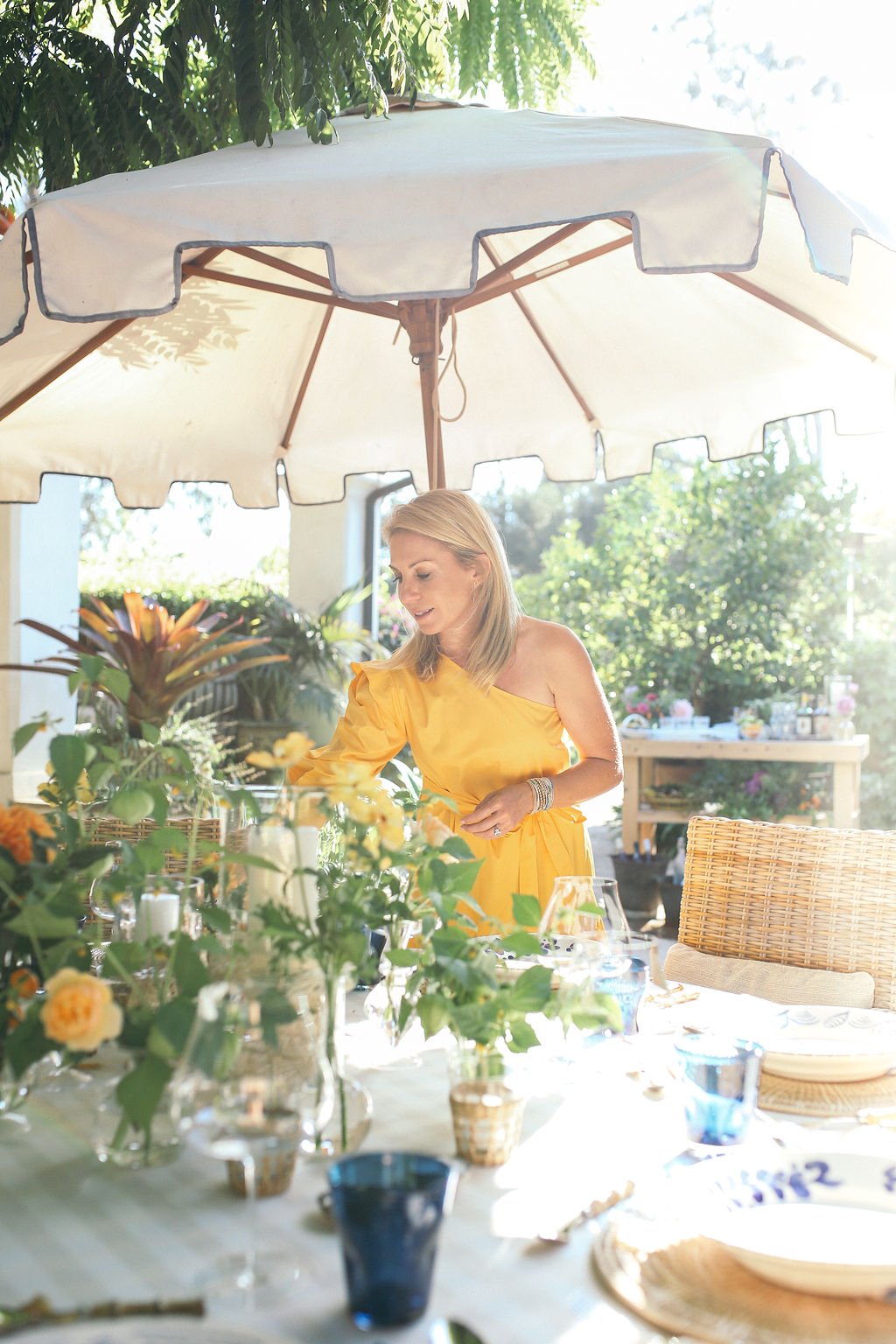 Valerie Rice dinner party, yellow dress, host, setting the table