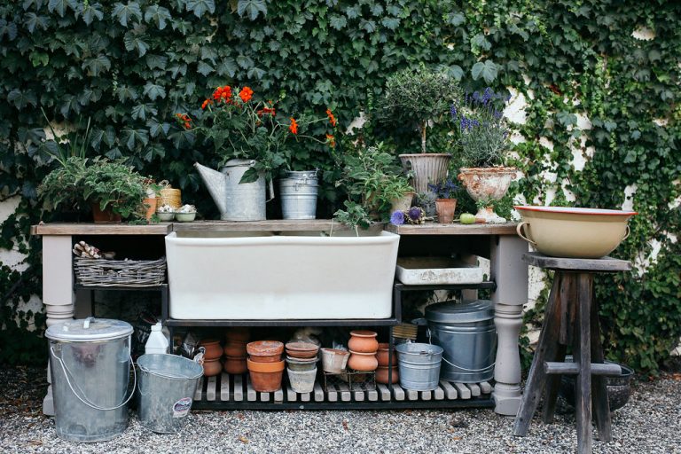 Valerie Rice dinner party in Santa Barbara, bougainvillea and mediterranean house exterior, bar on potting bench setup