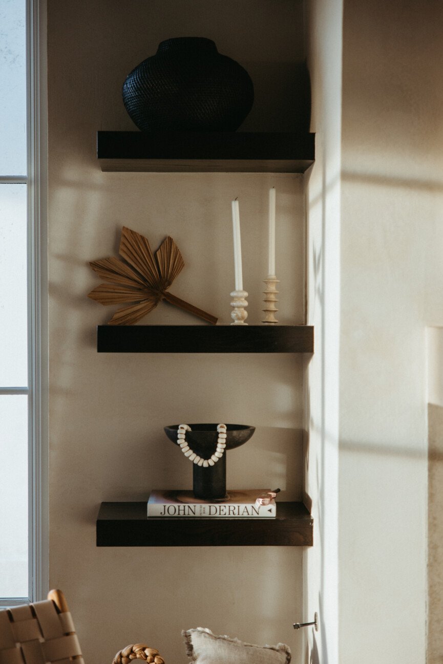 neutral living room bookshelf with natural textures