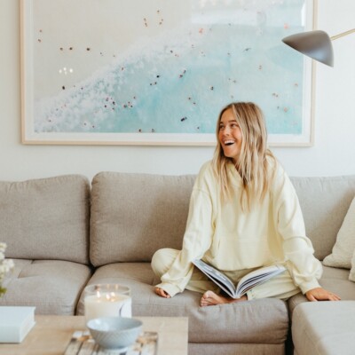 Woman reading on couch.