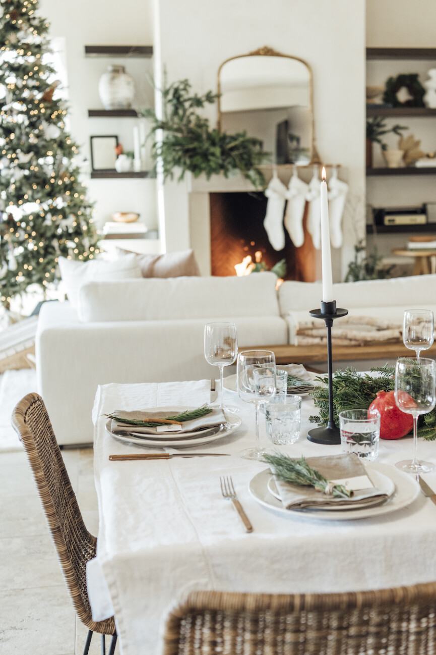 christmas table setting ideas-scandinavian inspired holiday tabletop with evergreen and pomegranates
