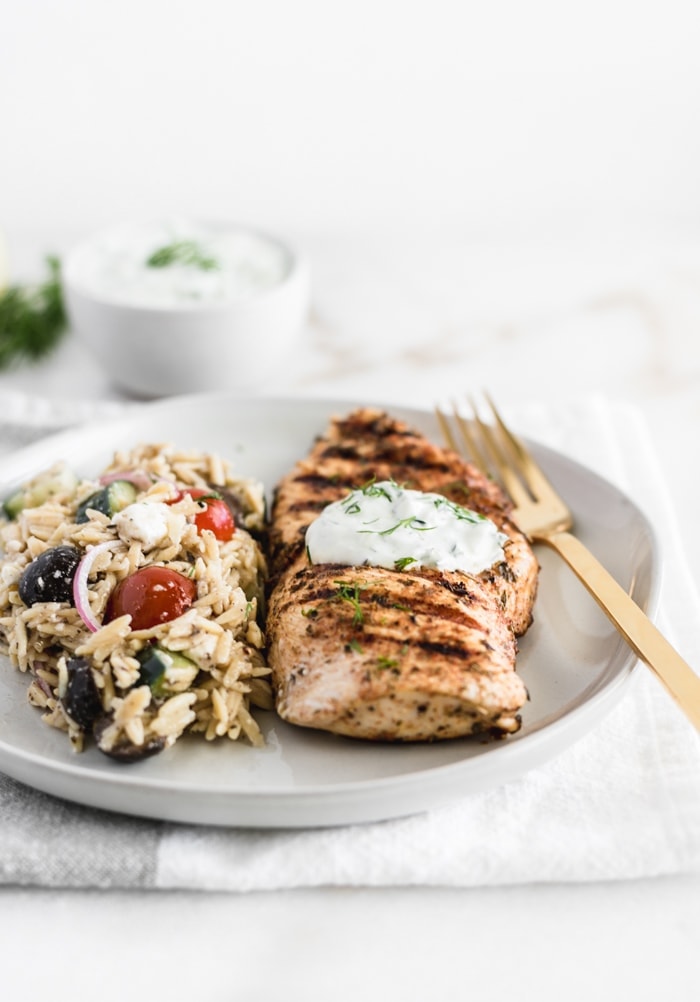 Grilled chicken with lime crema and Mediterannean-inspired orzo salad
