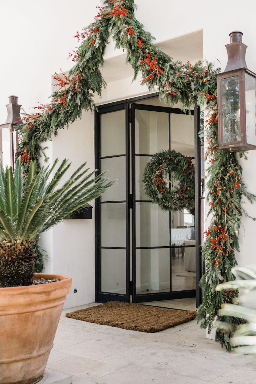 Evergreen christmas wreath and garland with red berries for front door, best festive decoration on front porch, how to make christmas wreath and garland