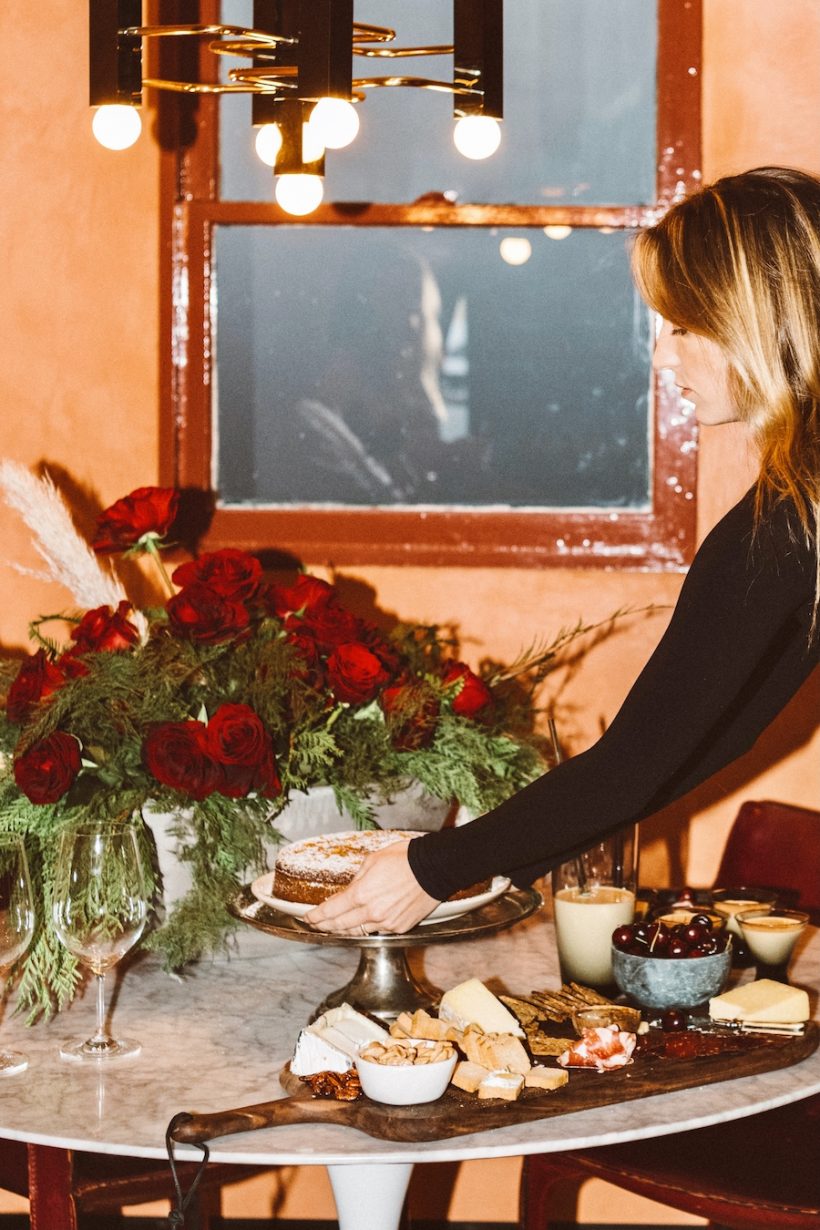 Red flowers, buffet spread, holiday party with Elle's Boutique and Austin