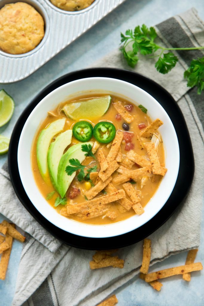 Creamy Pumpkin Chicken Tortilla Soup from Kim’s Cravings - winter soup recipes