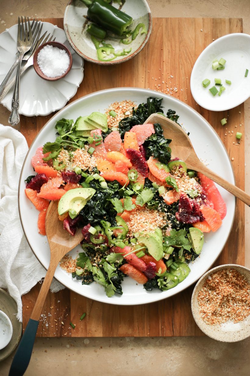 This kale and citrus salad with spicy tahini sauce is sunny on the plate