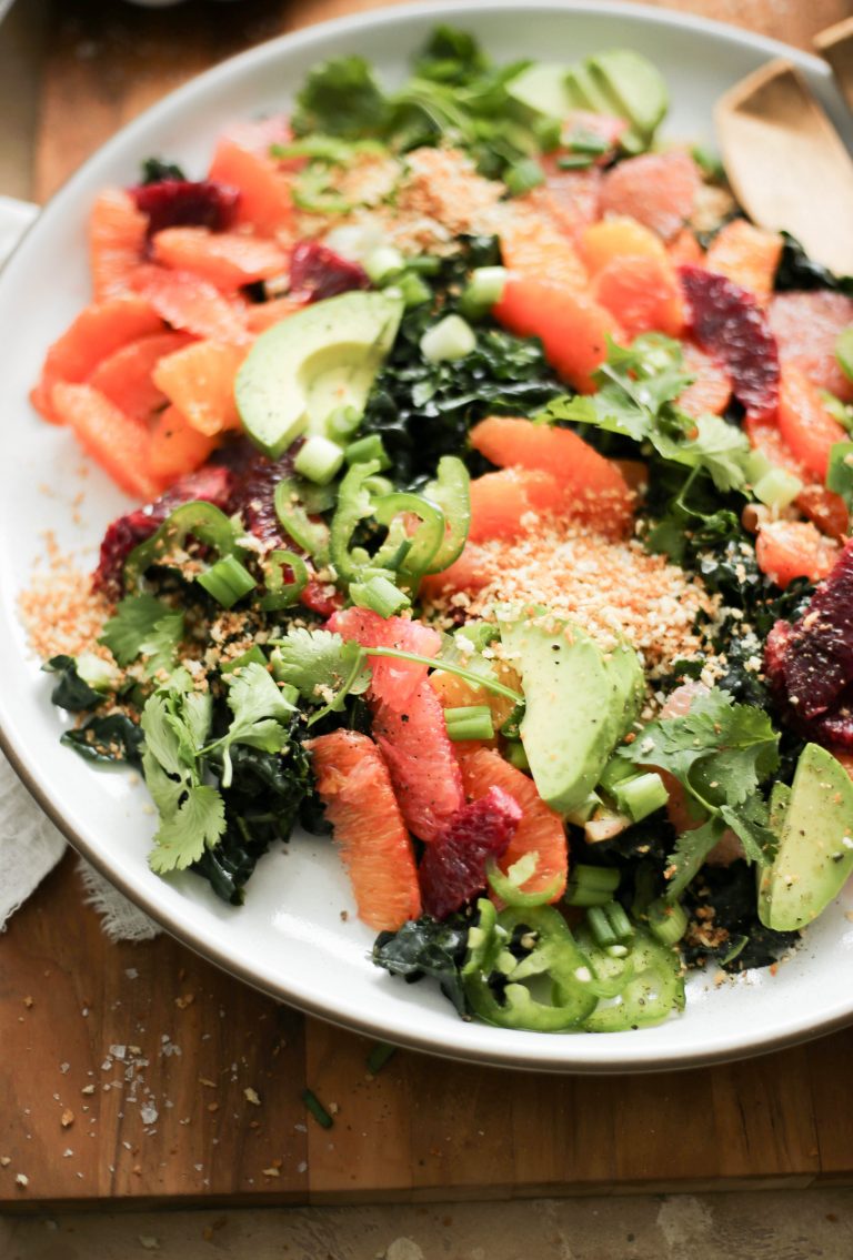 This kale and citrus salad with spicy tahini sauce is sunny on the plate