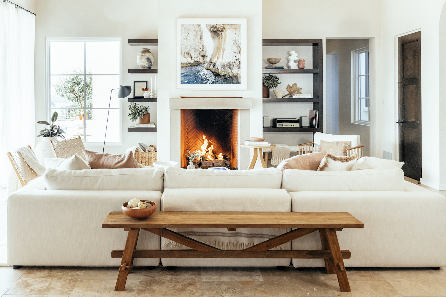 Living room with fireplace deals and bookshelves