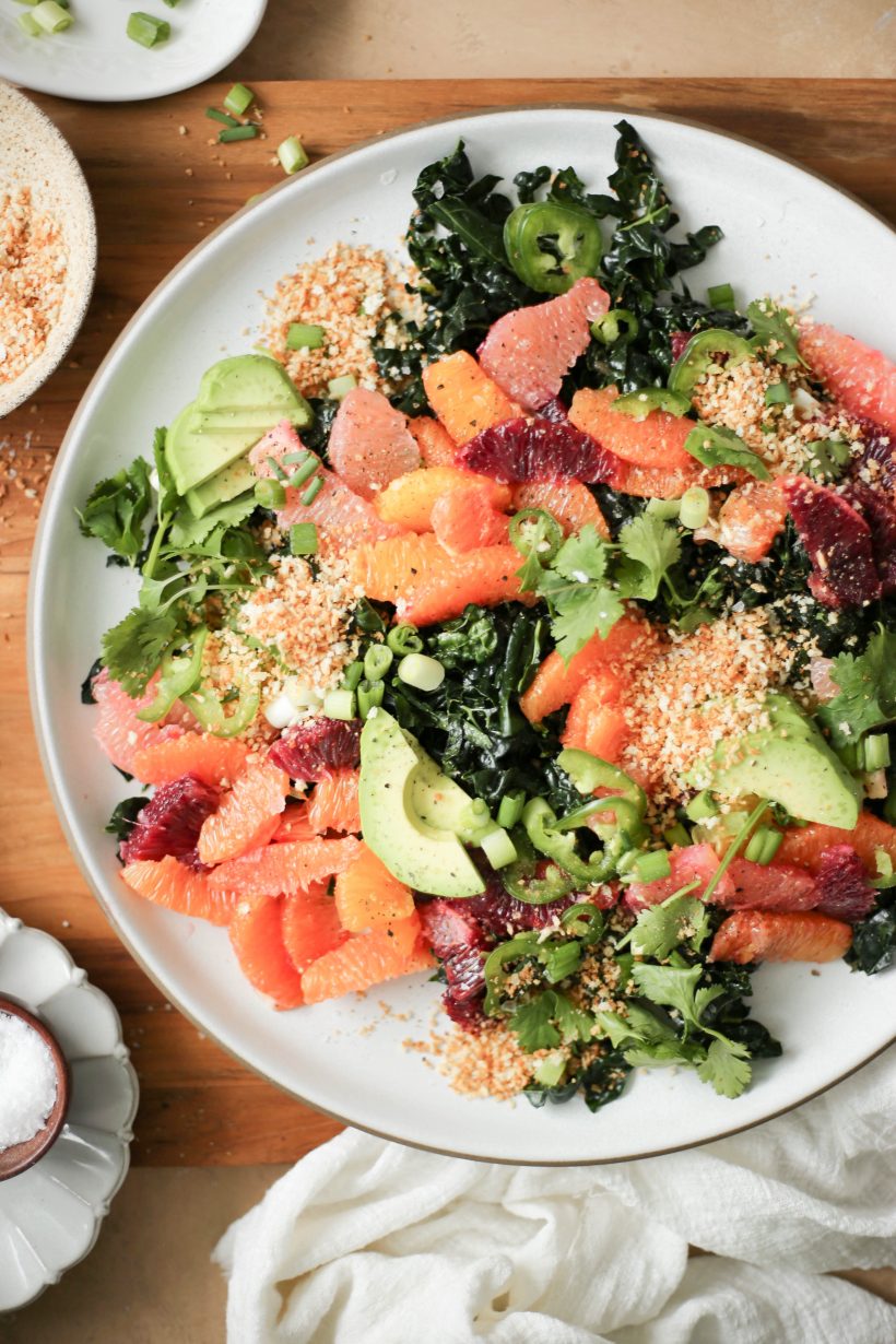 This kale and citrus salad with spicy tahini sauce is sunny on the plate