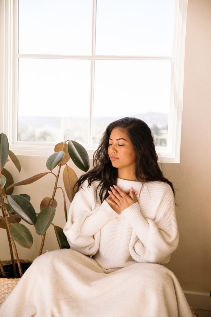 woman meditating, sweater, plant, blanket, mindfulness, Riley Reed photography_eating disorders