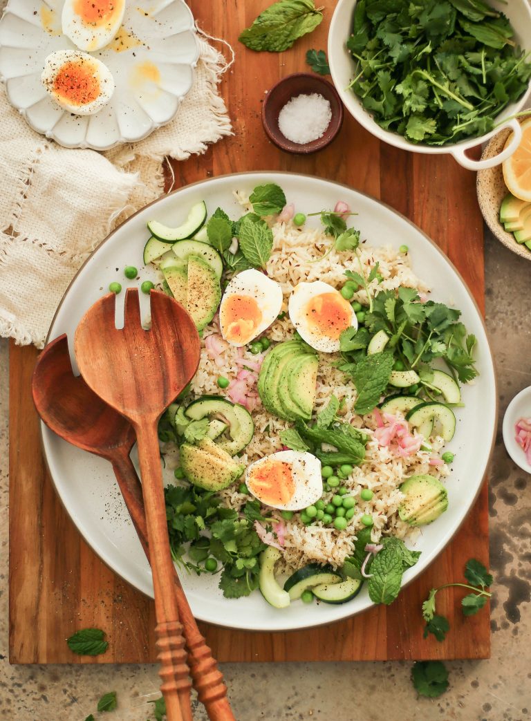 Bowl of Spring Rice Salad with Fresh Herbs Eggs and Avocado 
