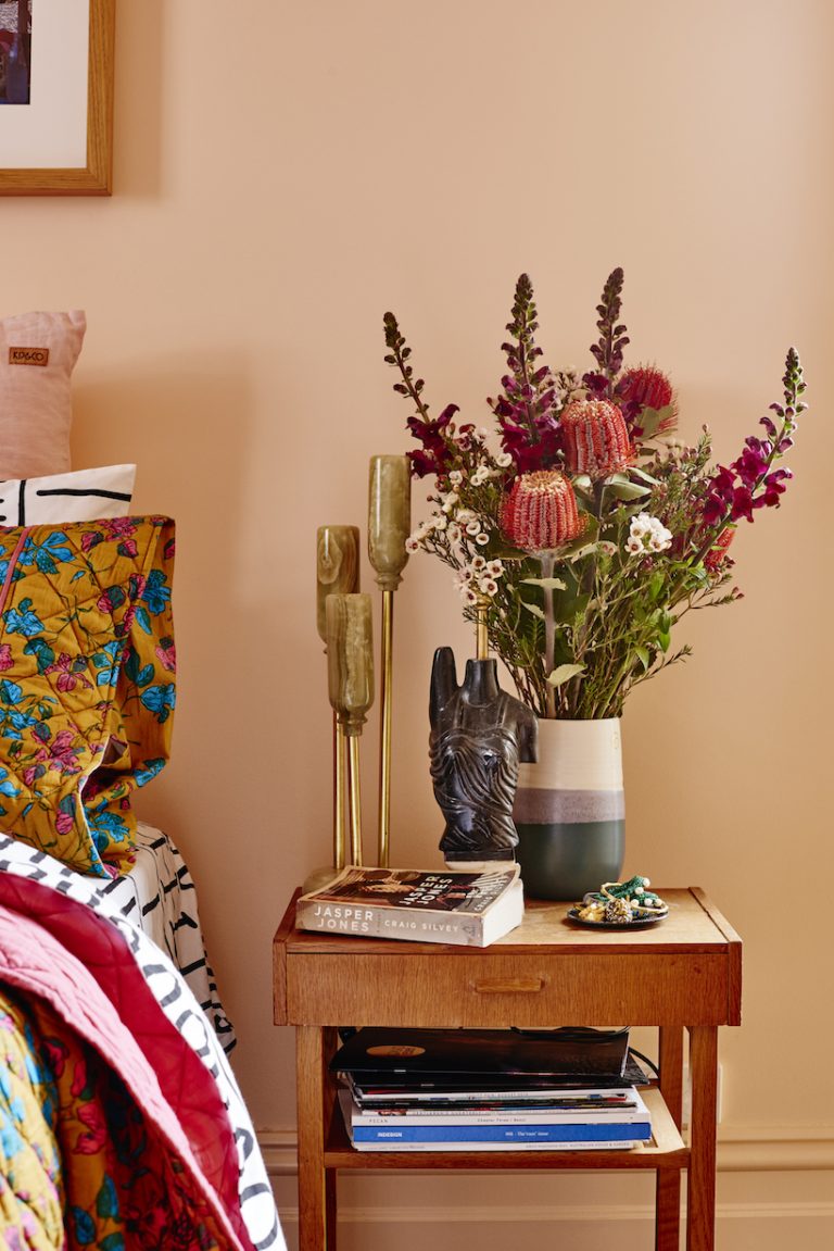 Alex McCabe nightstand with Jasper Jobes by Craig Silvey on her bedside table_best coral paint colors