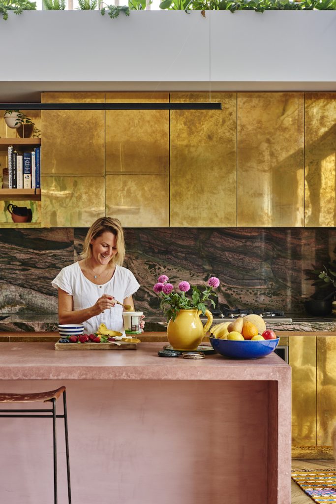 Alex McCabe making breakfast at her kitchen countertop_best coral paint colors