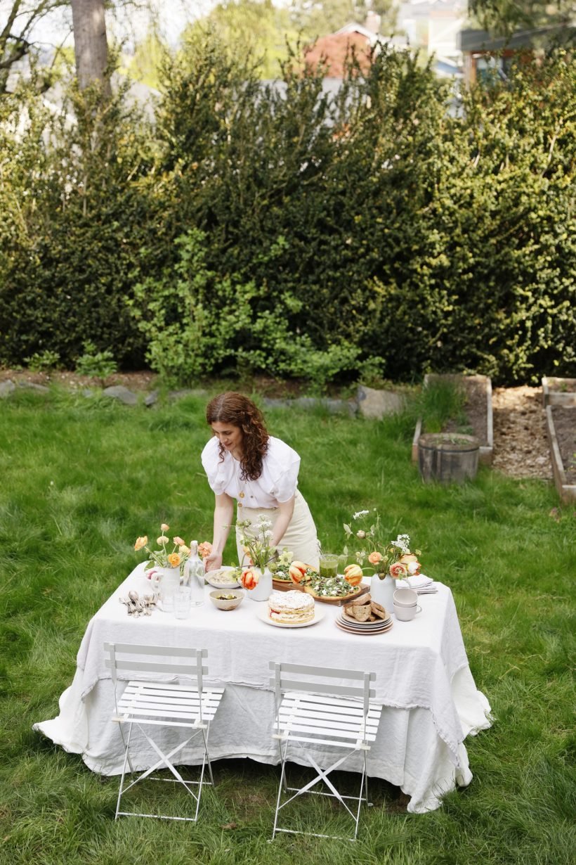 Aran Goyoaga setting the table for an outdoor party, flowers, tulips