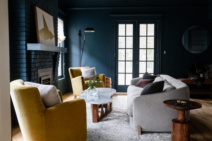 blue living room with sofa and chairs