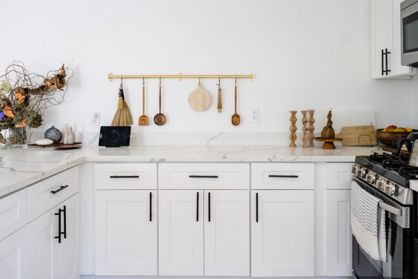 white kitchen with wood accessories