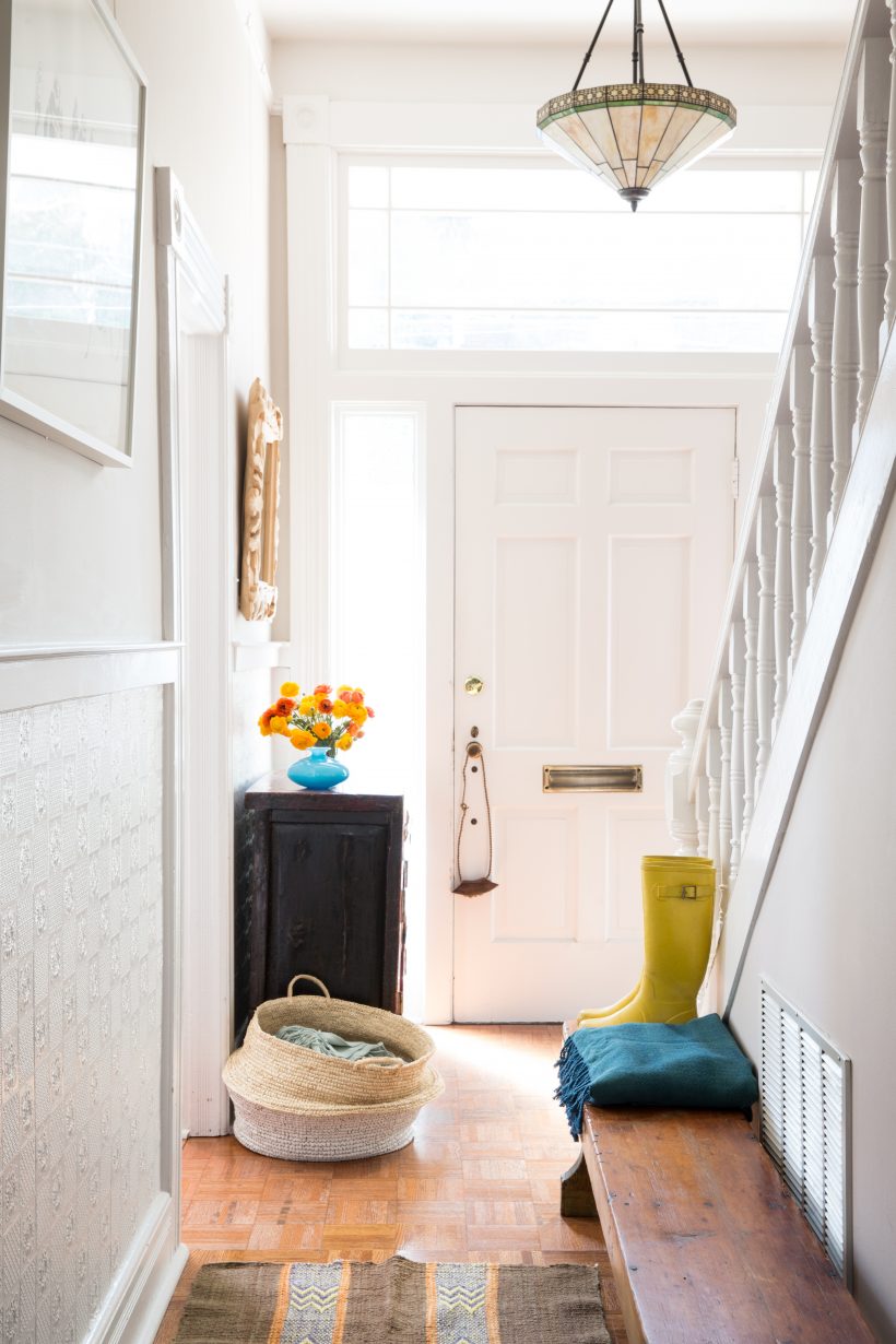 white simple entryway with boots