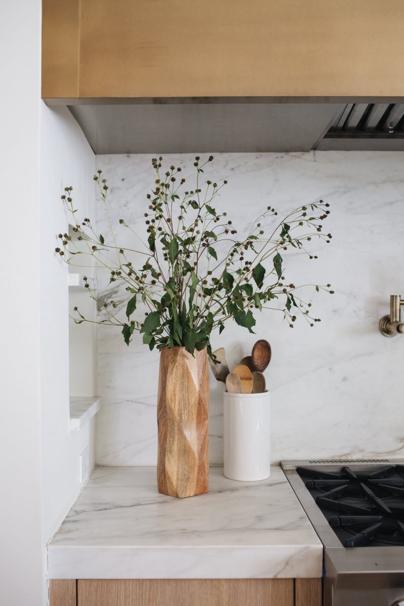 wood vase on marble counter