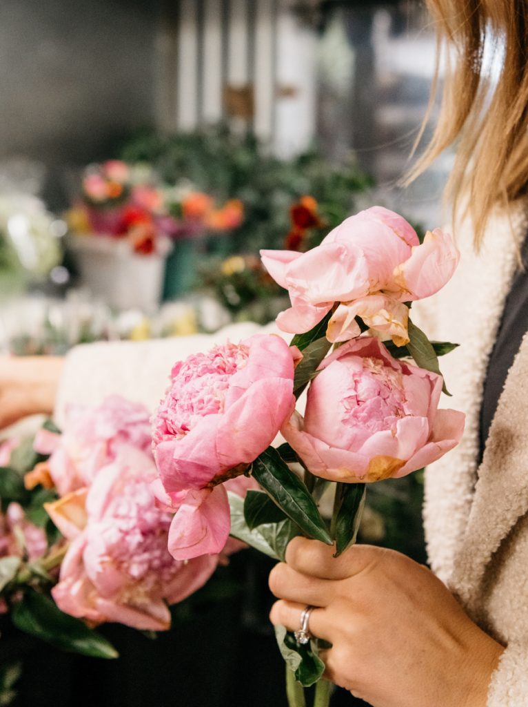 Camille Styles holding peonies_random acts of kindness ideas