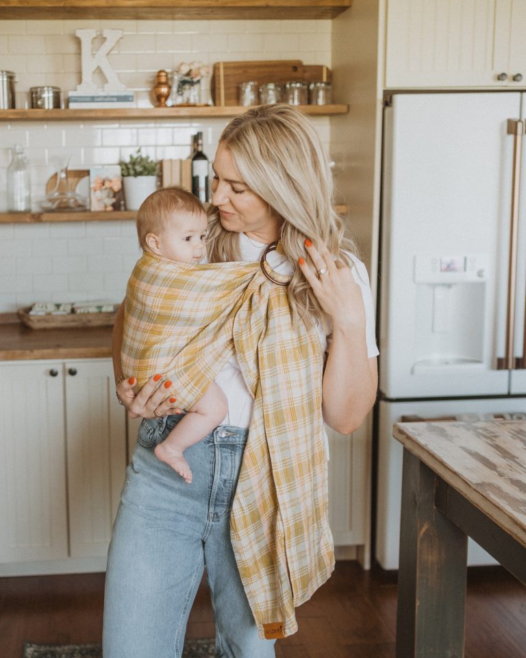 woman wearing baby in sling, how to boost fertility